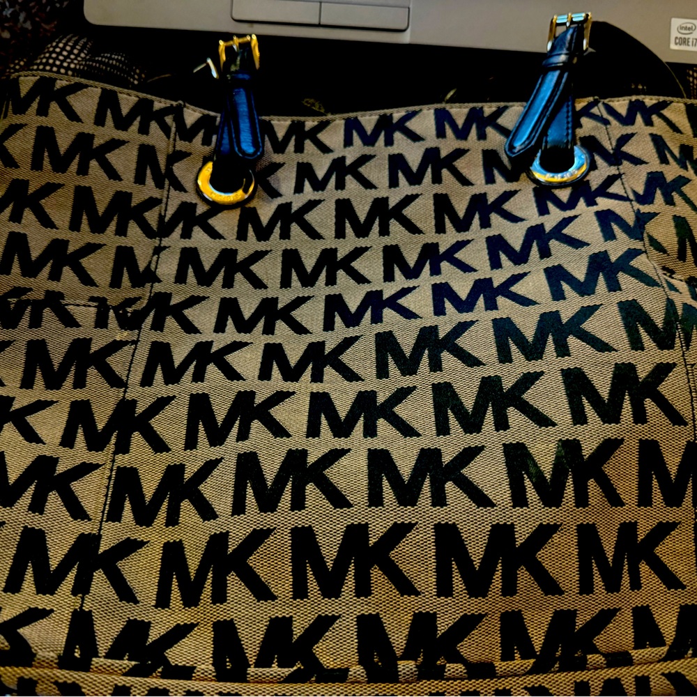 MK bag is great I just don’t use it. Looks brand new.